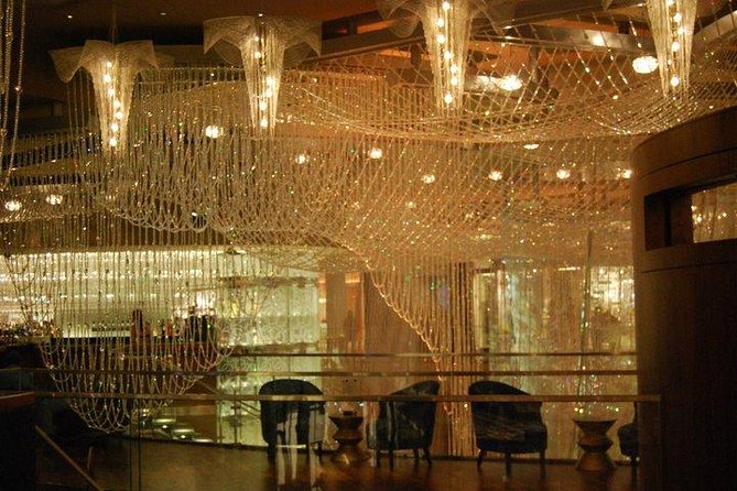 1.5-Hour Las Vegas Strip Limo Tour with Champagne and Photo Stops - Photography Delivery and Drink Details