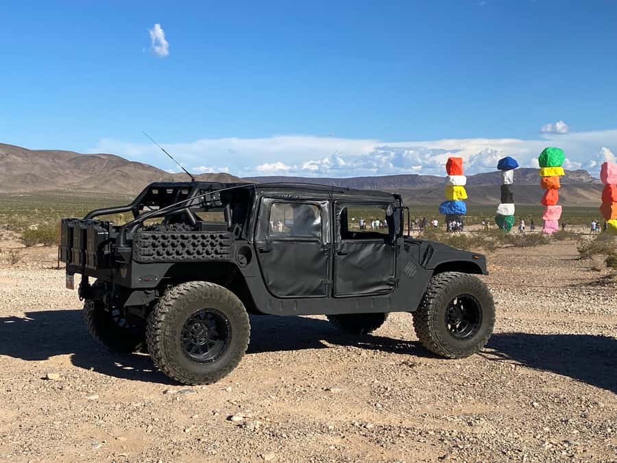Las Vegas: 7 Magic Mountains and Pioneer Saloon Hummer Tour - Seven Magic Mountains: neon-painted rocks with desert scale